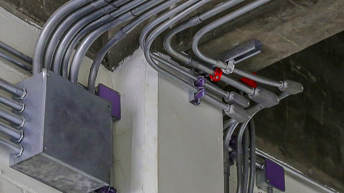 Electrical conduit installation with THHN wires routed through EMT metallic conduits